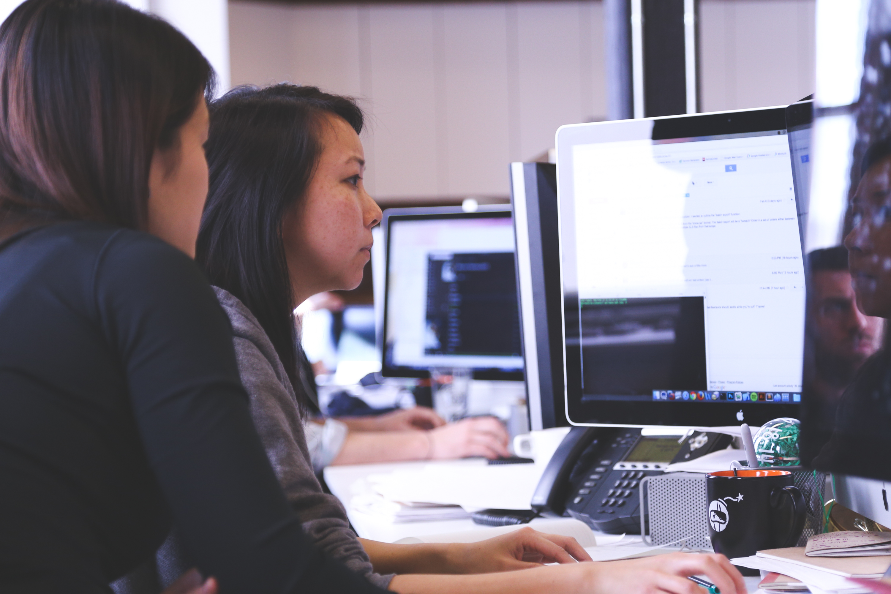 IT employees working on a computer